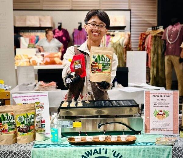 Hawaiʻi ʻUlu Cooperative booth with product samples at the Mana Up Showcase